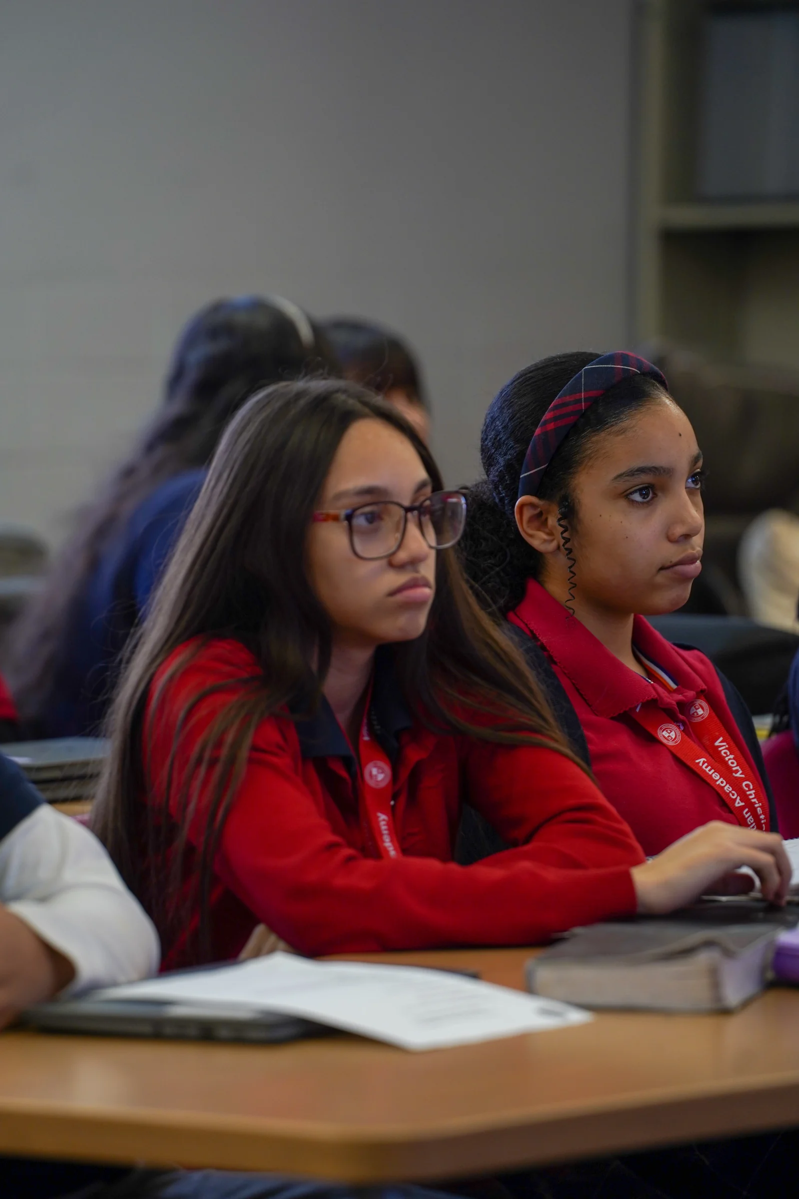 VCA students with Bibles open at their desks during class